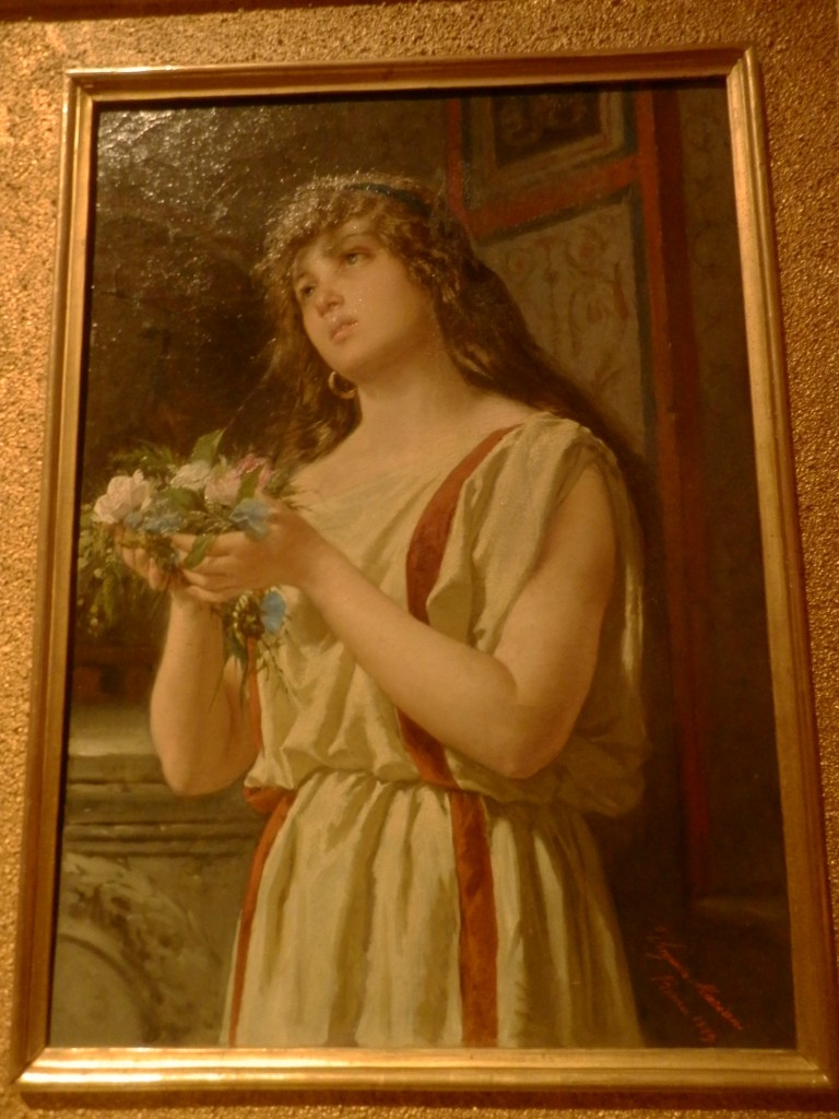 "Fanciulla che offre fiori in abito pompeiano" (1884) di Virginia Barlocci.